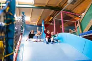 Children on indoor play slide Creeky's Playhouse