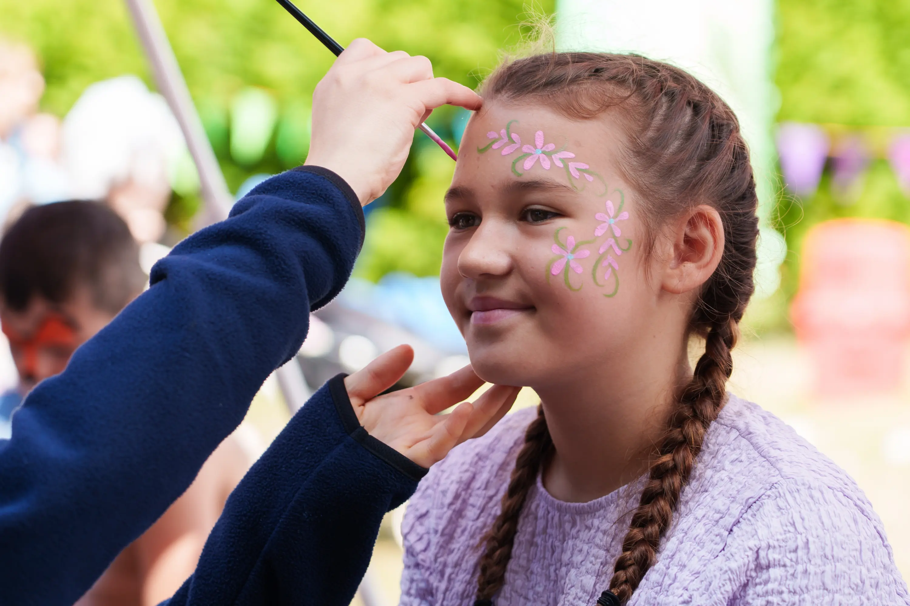 Girl getting her face painted
