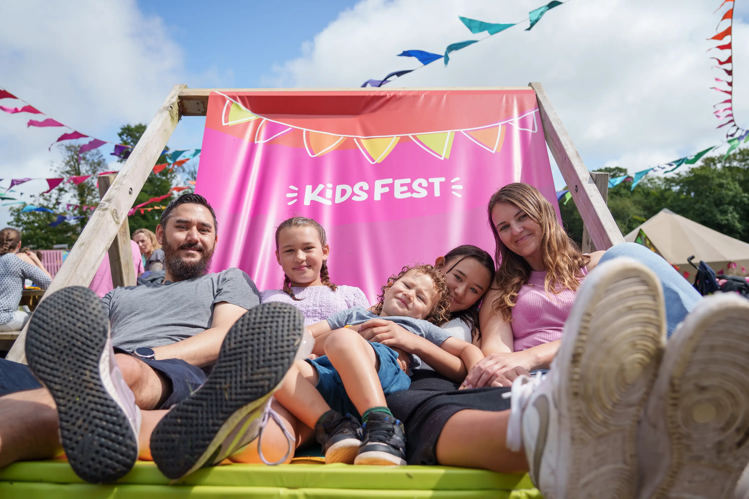 A family relaxing on the deckchair at Kids Fest 