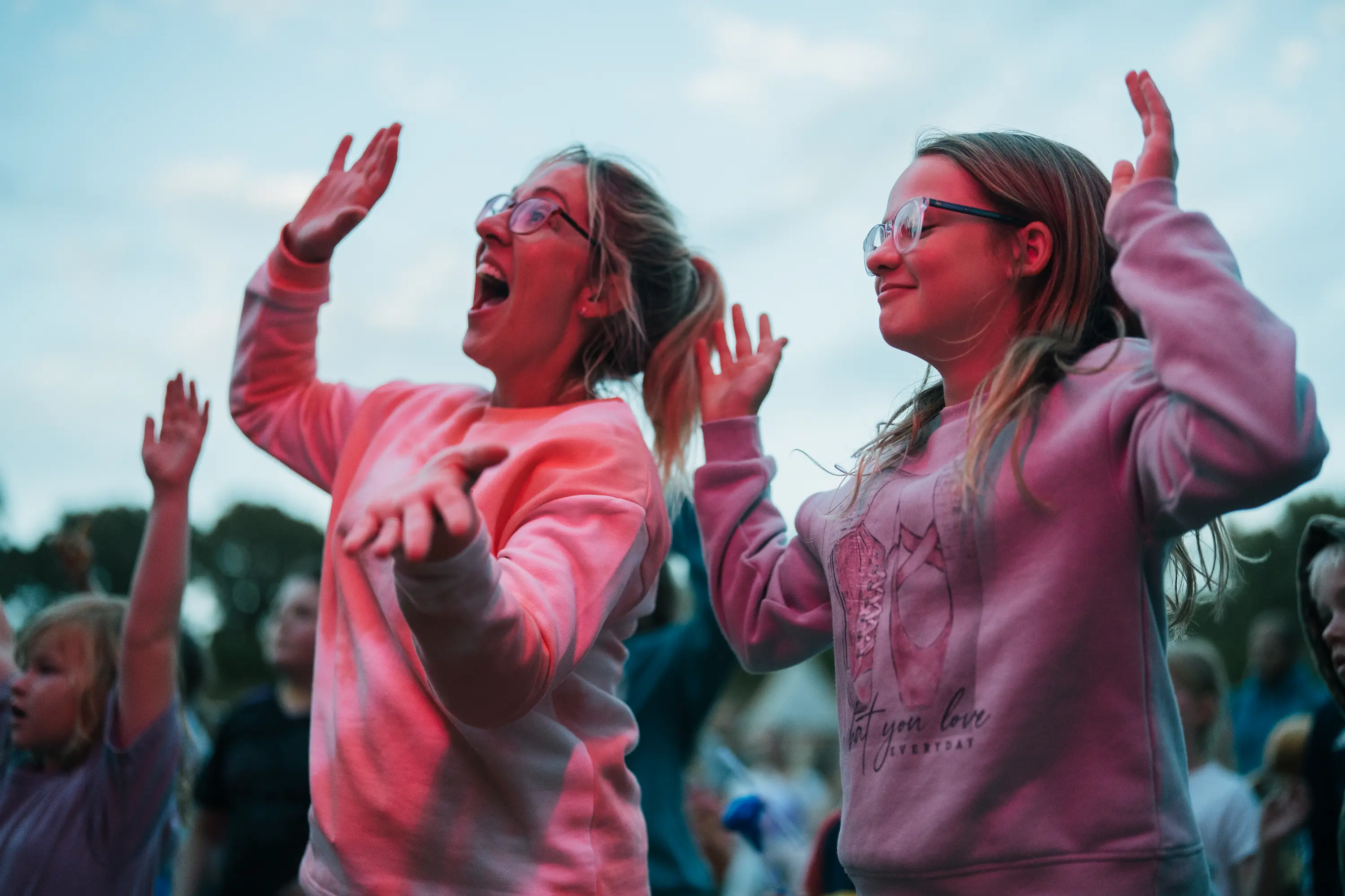 A girl and woman dancing to tunes at Kids Fest 