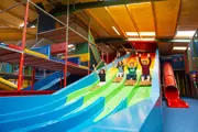 Children on indoor play slide