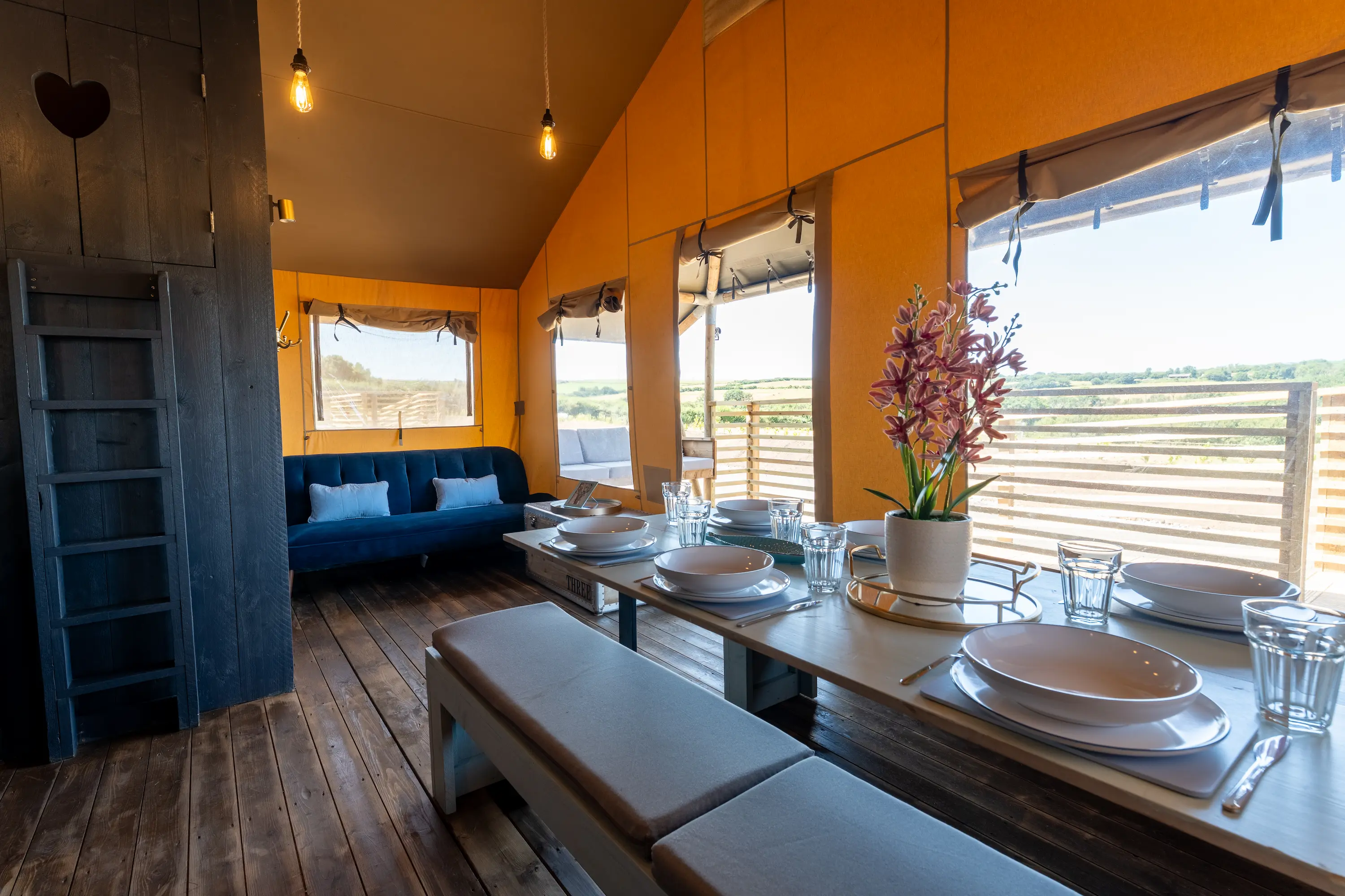 Side on angle of living and dining room inside Safari Lodge 