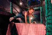 Girl at hidden garden indoor play