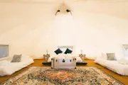 Wide angle view of inside the glamping bell tents 