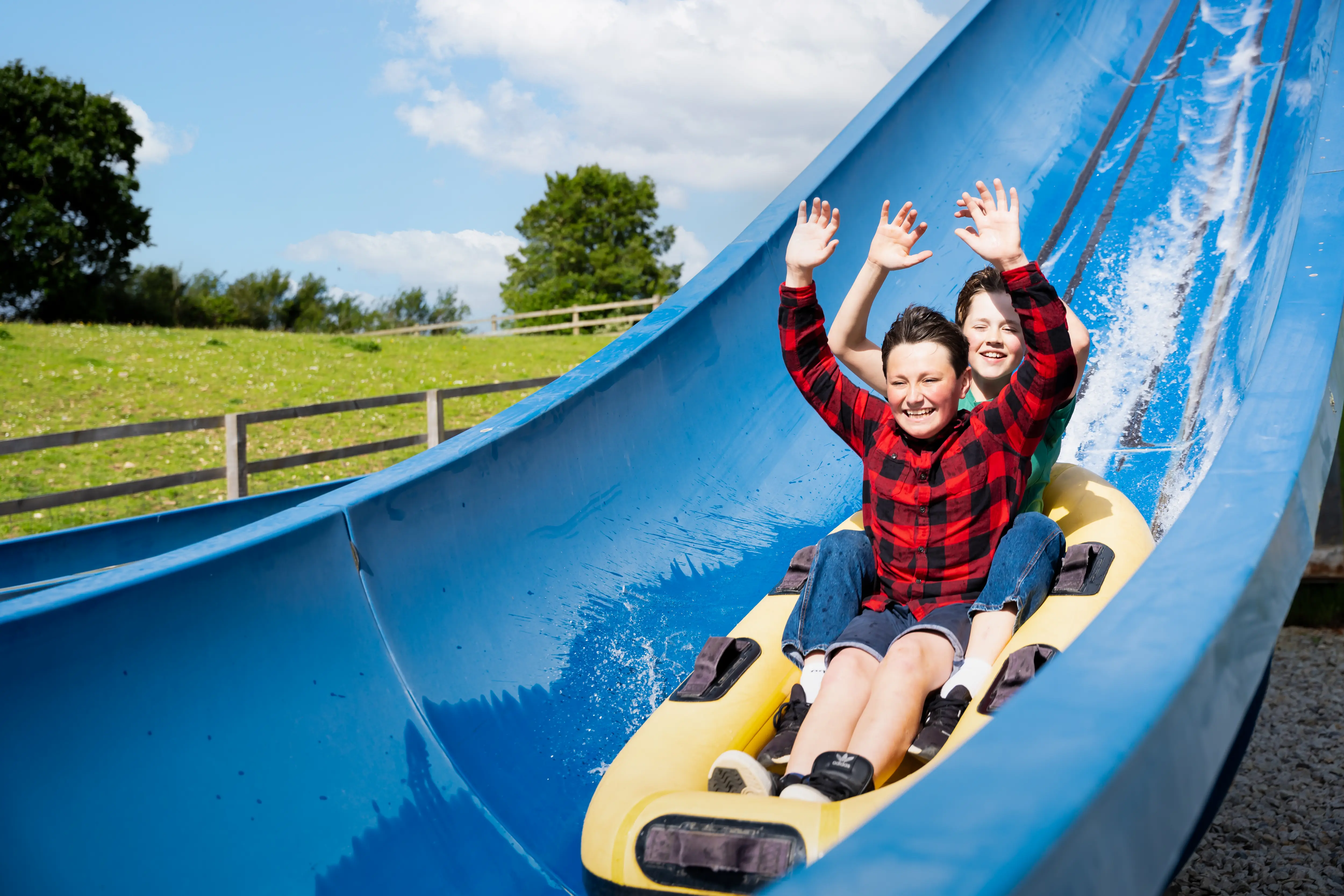 Two boys on raging rivers water ride