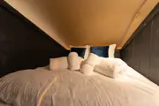 A bed inside the safari lodge 